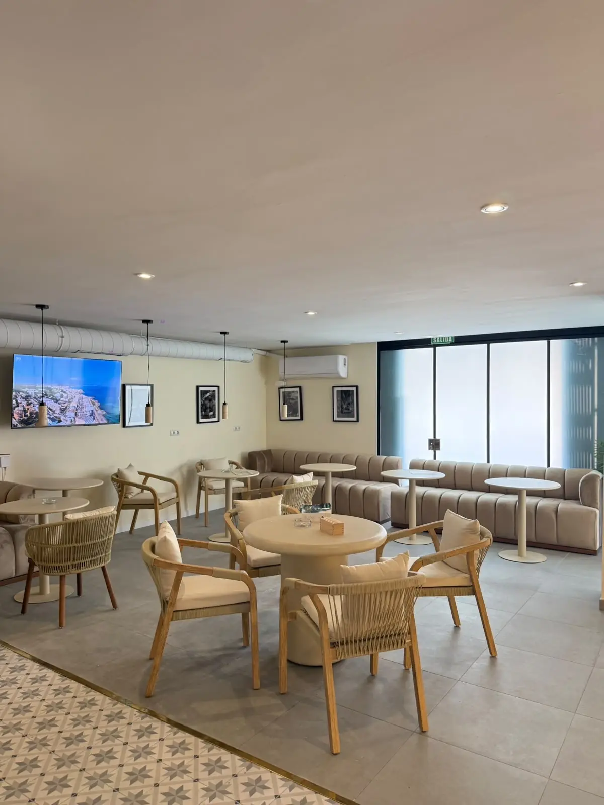Sofas and armchairs by the large windows